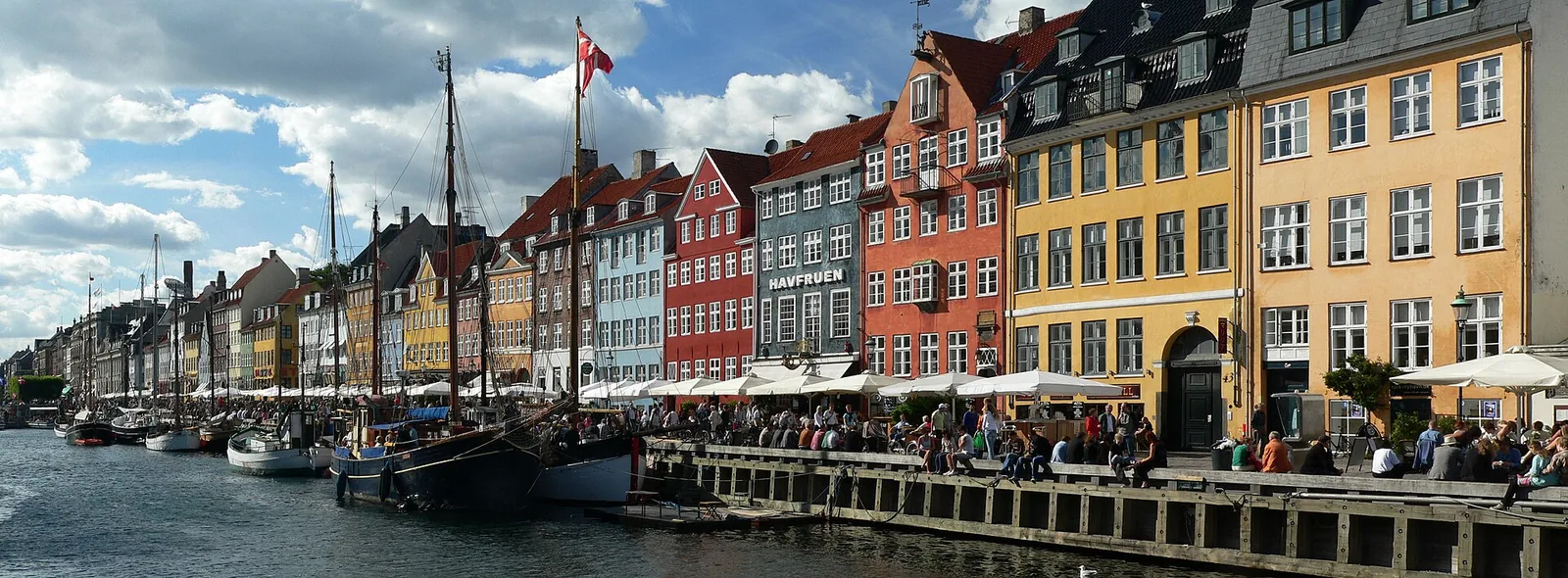 Panoramic view across Copenhagen’s colorful Nyhavn waterfront